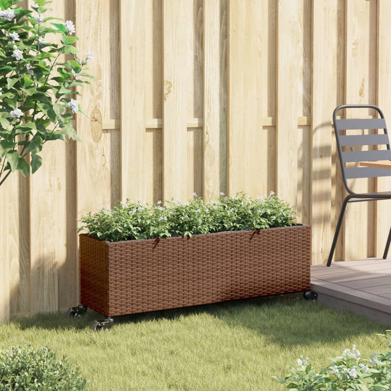 Afbeelding laden in galerijviewer, Vidaxl plantenbak met wielen 3 potten 107x32x38 cm poly rattan bruin