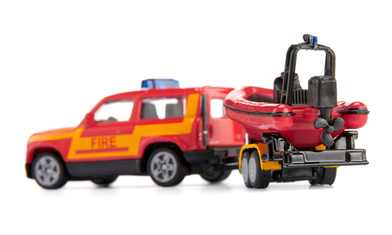 Afbeelding laden in galerijviewer, Siku brandweerwagen land rover defender met reddingsboot