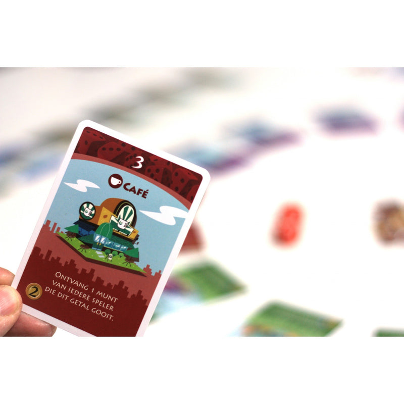 Afbeelding laden in galerijviewer, White goblin games machi koro dobbelspel (nederlands, 2 - 5 spelers, 40 minuten, vanaf 7 jaar)