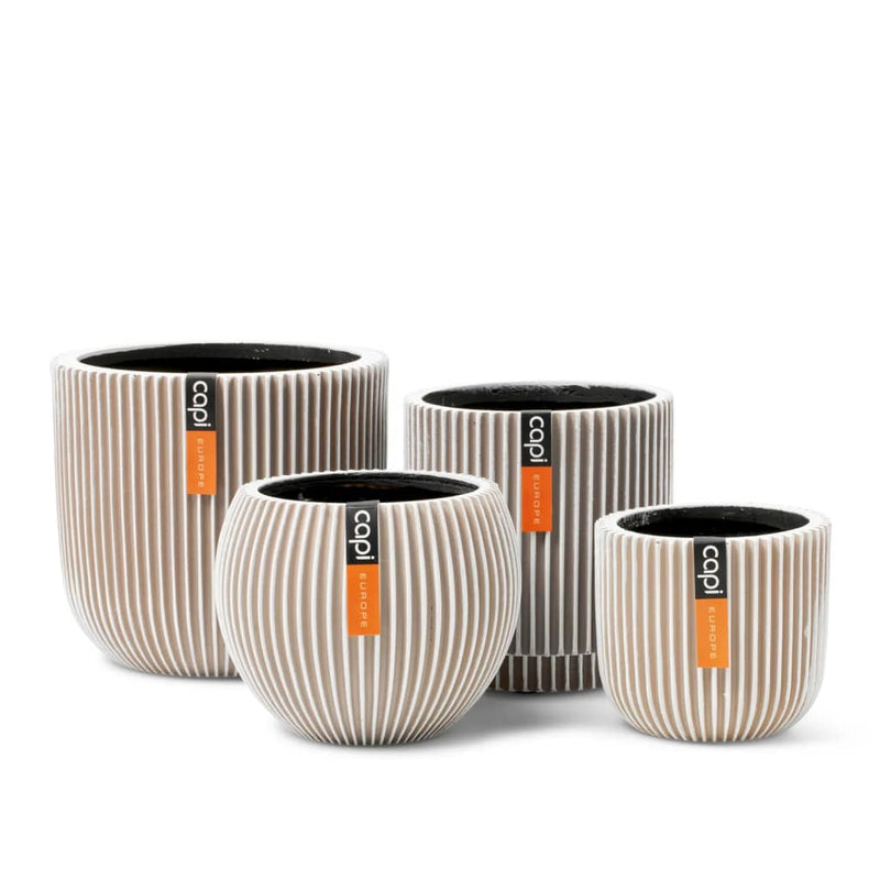 Afbeelding laden in galerijviewer, Capi Capi 4-delige Bloempottenset Groove ivoorkleurig
